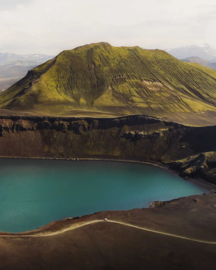 Drone picture of Bláhylur, a deep blue lake ina scenic volcanic landscape in the highlands of Iceland